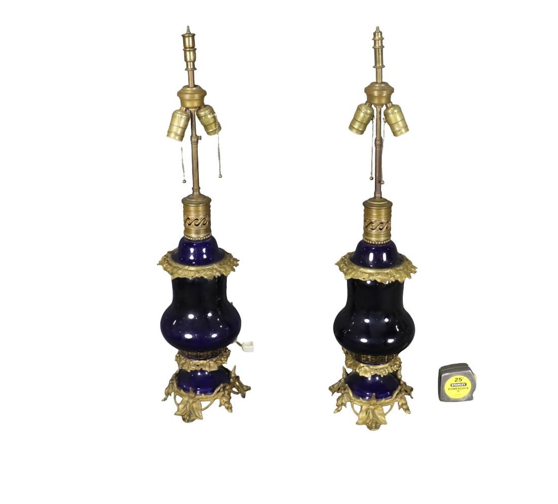 PAIR COBALT BLUE BRONZE & PORCELAIN LAMPS: Porcelain. Bronze. 31 3/4" h x 6 1/2" diameter.