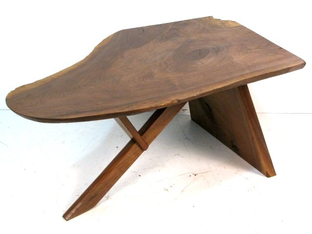 STUDIO WALNUT COFFEE TABLE manner of NAKASHIMA: Unsigned. Walnut. Very good condition. 20 1/2"h. x 44 1/2"w. x 25"d.