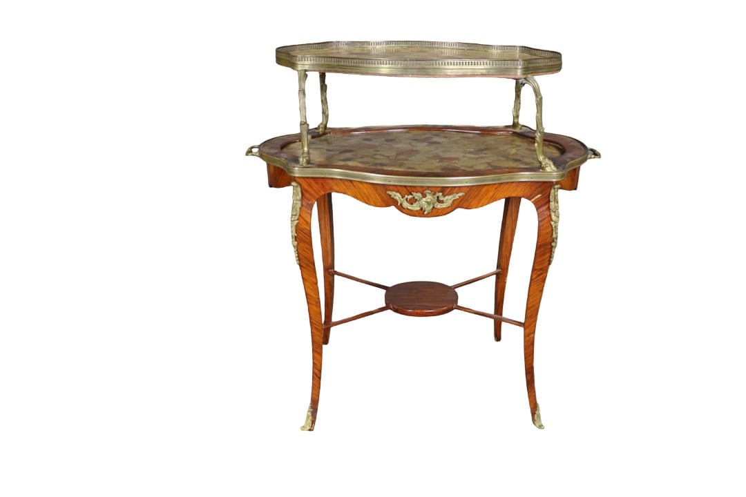 2 TIER MARBLE TOP TEA TABLE: Marble tops. Satinwood. Bronze gallery and trim. 2 tier. 36" h x 34 1/2" w x 21 3/4" d.