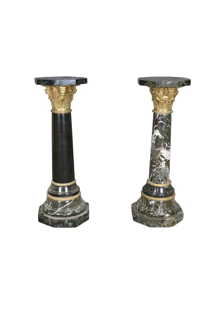 PAIR OVERSIZED BLACK WHITE VEINED & BRONZE MOUNTED PEDESTALS: Black white veined marble. Bronze mounted. 44 3/4" h x 16" diameter.