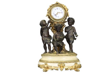 BRASS & MARBLE 3 CHERUB FIGURAL CLOCK: Brass. Marble. Cherub figural. Stamped Japy Freres on back. 5 1/2" h x 15 1/2" w x 10 3/4".
