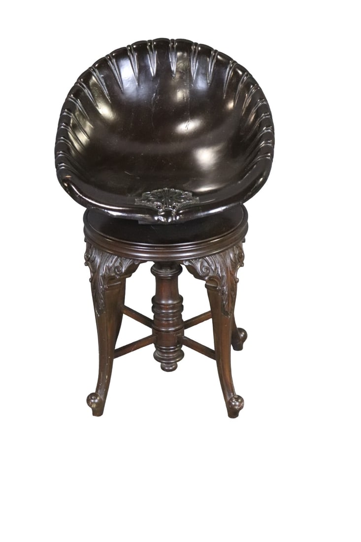 SCALLOP SEAT MUSICIANS CHAIR: Adjustable. Carved wood. Swivels. 27 1/2" h x 18 1/4" w x 23" d. Seat height 19".