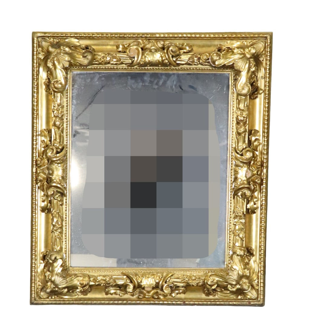 ANTIQUE GILT CARVED MIRROR: Gilt. Carved. 40 1/2" h x 34 1/2" w x 5 3/4" d.