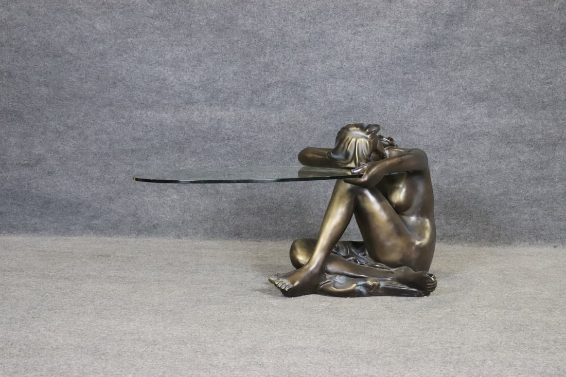 NUDE FIGURAL GLASS & RESIN TABLE: Resin nude figure. Glass. 2 piece. 25 1/2" h x 26 1/2" w x 47" d.