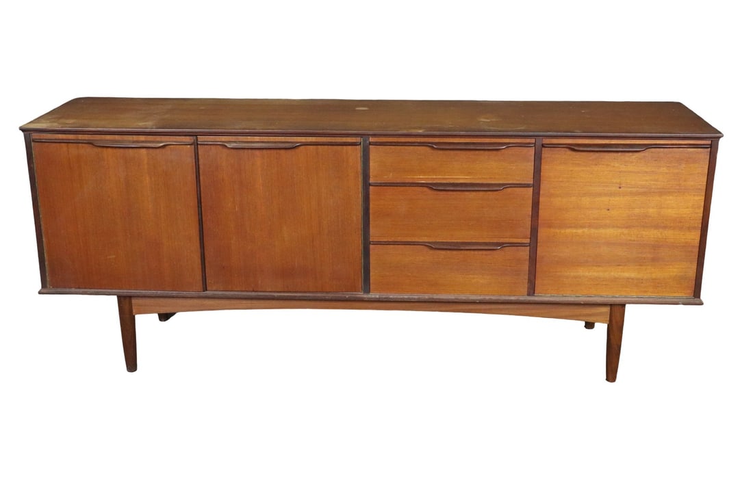 MID CENTURY MODERN TEAK SIDEBOARD: Teak. 3 dovetailed drawers. 1 drop down door on right. 2 doors on left containing 1 shelf. 28 1/2" h x 72" w x 18 1/4" d.