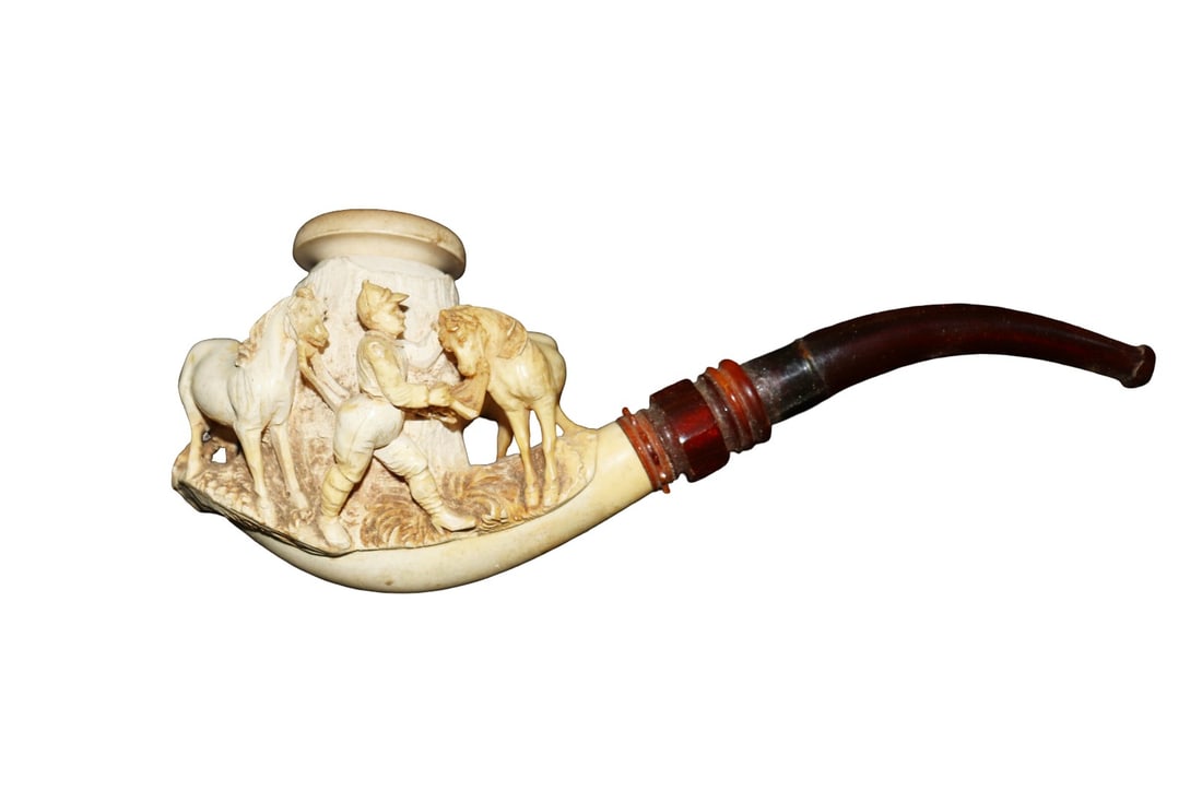 ANTIQUE MEERSCHAUM JOCKEY FEEDING HORSE PIPE: Reel amber stem. Jockey feeding horse. 4" including case. Measurements are shipping measurements.