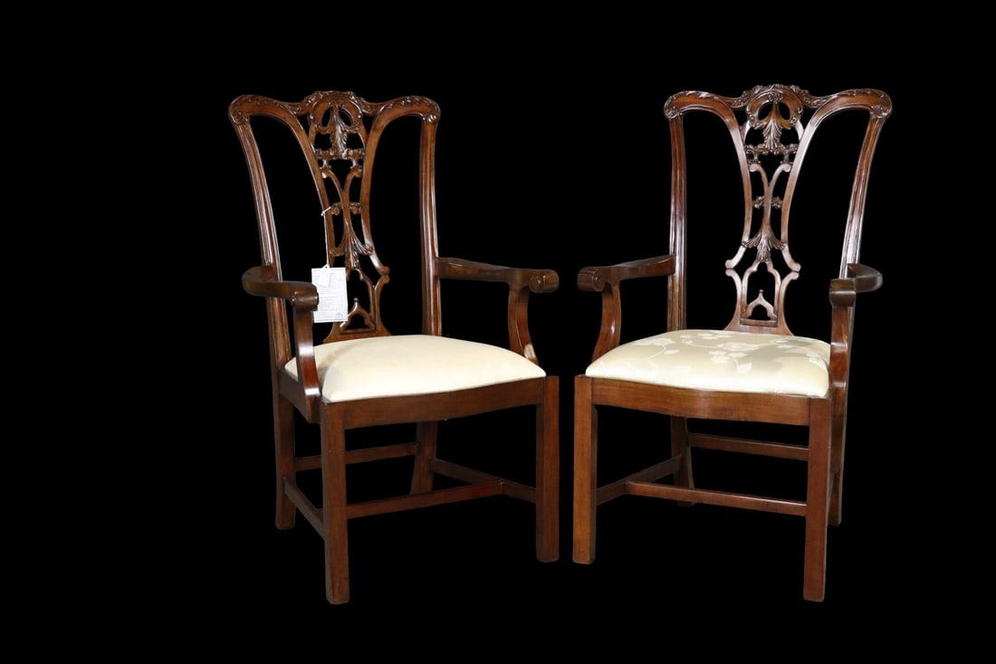 COMPANION PAIR SCARBOROUGH HOUSE CHIPPENDALE STYLE MAHOGANY DINING ARMCHAIRS: Mahogany frames. Upholstered seats. Carved. 42 1/4" h x 24 1/2" w x 25 1/2" d. Seat height 19".