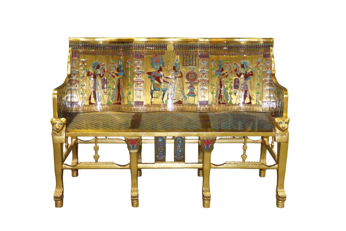 EGYPTIAN STYLE GOLD GILT BENCH: Figural. Gold gilt. Paw feet. 8 legs. 41 1/8" h x 58" w x 33" d.
