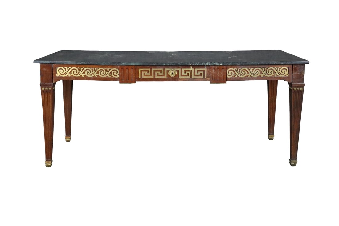 EARLY 20TH C LOUIS XVI STYLE BRONZE MOUNTED DESK: Wood frame. Bronze mounted. Marble top. One drawer. 29 7/8" h x 71 1/2" w x 34" d.