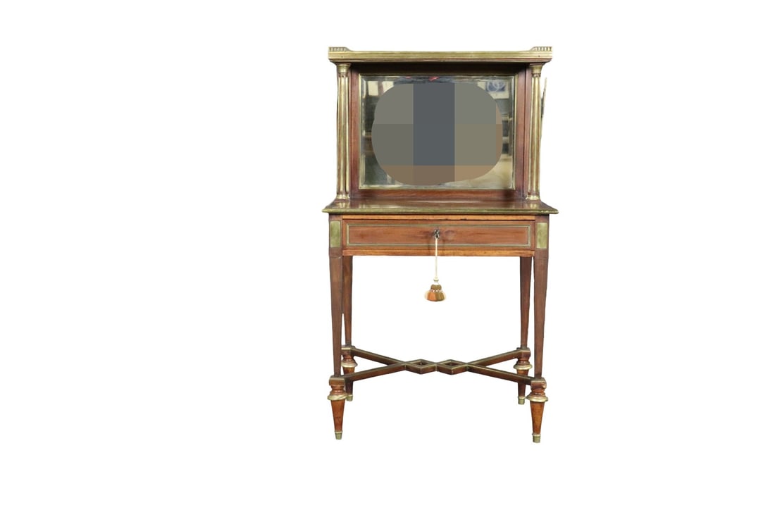 FRENCH DIRECTOIRE STYLE BRASS TRIMMED MARBLE TOP VANITY/DESK: Wood. Brass accents. Marble top. Gallery top. Mirrored back. Pull out leather top desk slides to open to a drawer. 47" h x 27" w x 19" d.