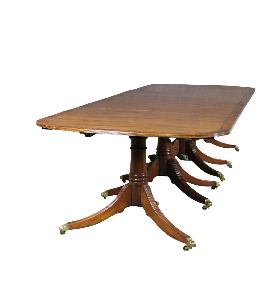 4 PEDESTAL BANDED DINING TABLE: Banded. 4 pedestal base. On casters. Metal paw feet. 28 7/8" h x 137 1/2" w x 47 5/8" d.
