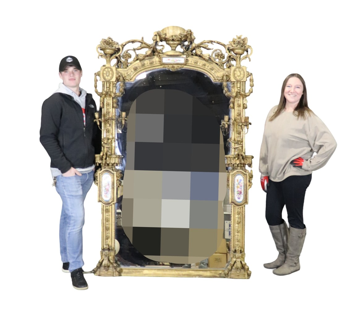 19TH C FIGURAL HEAVILY CARVED GOLD LEAF FIGURAL MIRROR WITH SEVRES PLAQUE: Gilded. Carved. Cherub figural. 3 candle holders on each size. Porcelain plaque inserts.