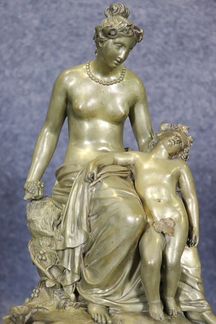 DORE BRONZE STATUE MOTHER & CHILD ON MARBLE BASE: Dore bronze. Marble base. 15 1/2" h x 10" w x 6 1/4" d.