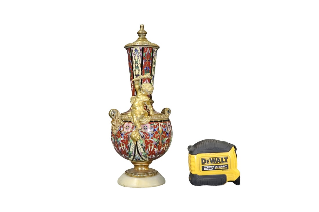 CLOSOINNE ENAMEL & BRONZE URN WITH COVER: Enameled. Bronze. Putti figural. Marble base. 11 1/2" h x 5" w x 4 1/2" d.