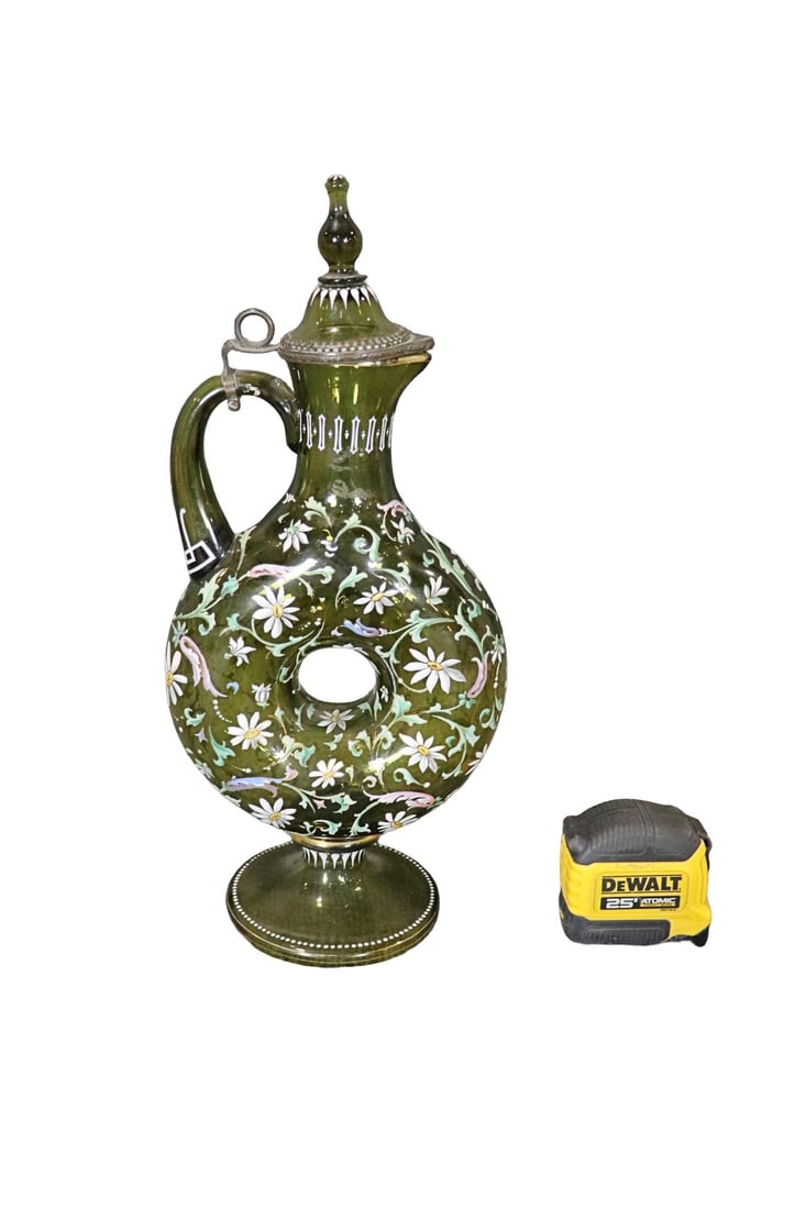 MOSER STYLE GLASS EWER WITH COVER: Green glass. Metal around top of rim. 16 1/4" h x 7 1/2" w x 4 1/2" d.