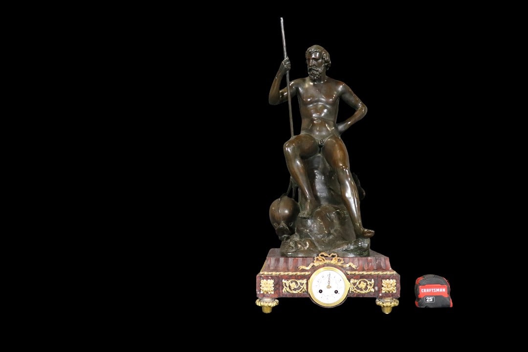 ROUGE MARBLE CLOCK WITH BRONZE NUDE FIGURE: Rouge marble. Bronze. Nude figural. 29 1/2" h x 13" w x 13 1/2" d.