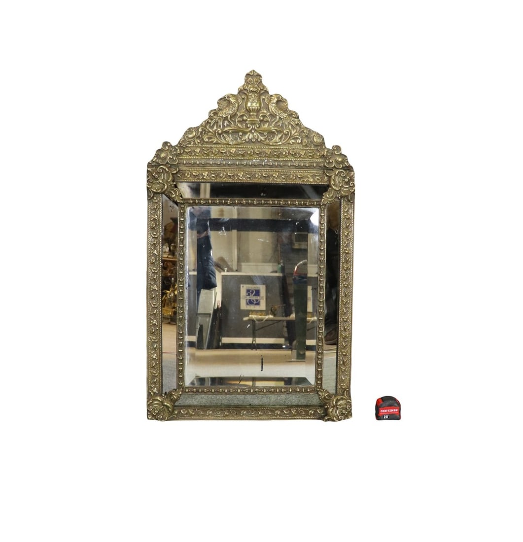 BRASS WALL HANGING MIRROR: Brass. Beveled glass. 44 1/2" h x 25 7/8" w x 3 3/4" d.