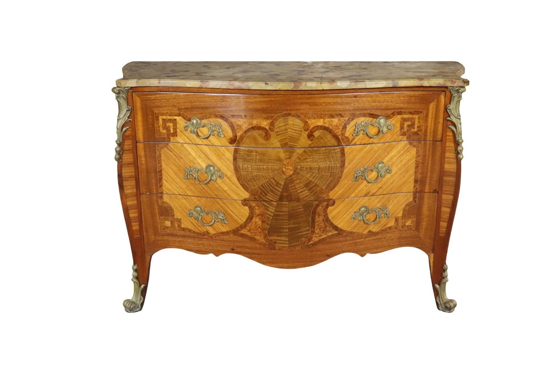 LOUIS XVI STYLE GILT BRONZE MOUNTED INLAID MARQUETRY MARBLE TOP COMMODE AFTER MODEL BY JEAN LELEU: Gilt bronze mounted. Inlaid. Marquetry. Marble top. 3 dovetailed drawers. 34 1/4" h x 52 1/2" w x 22 3/4" d.