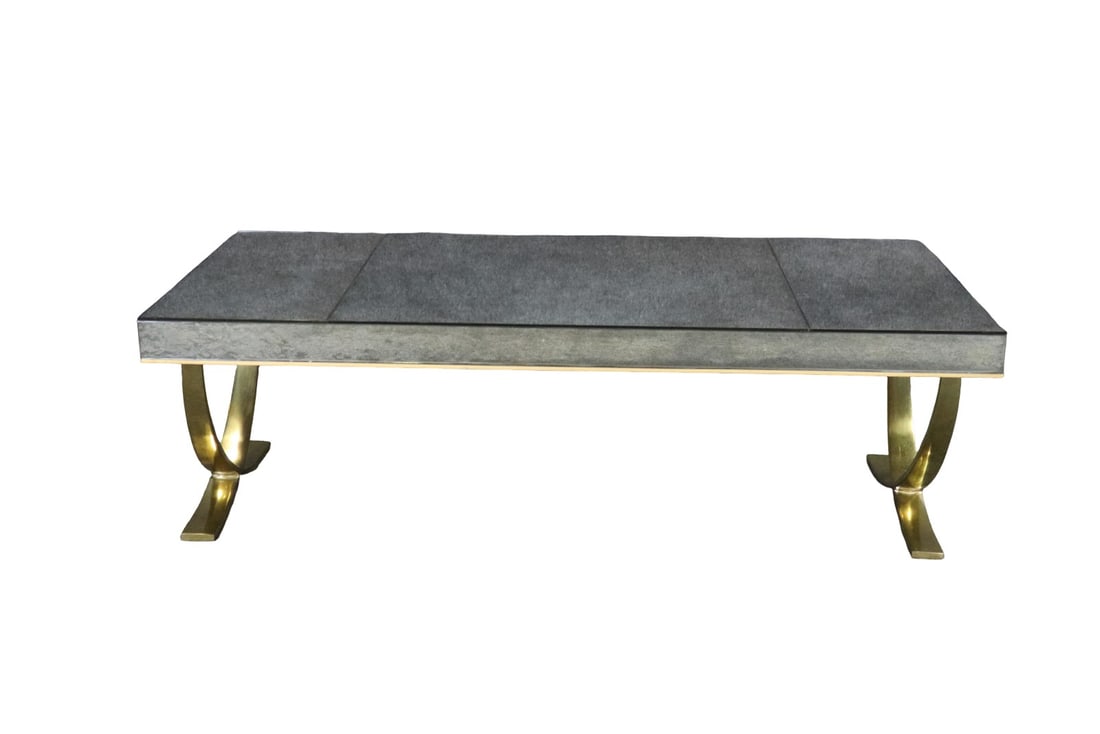 JACQUES ADNET STYLE DISTRESSED MIRRORED TOP & BRASS COFFEE TABLE: Brass frame. Distressed mirrored top. 17 3/8" h x 54" w x 25" d.