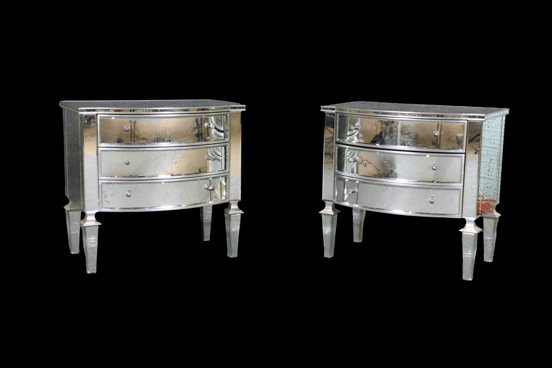 PAIR NANCY CORZINE BOW FRONT MIRRORED 3 DRAWER CHESTS: Silver leaf. Mirrored. 3 drawers. Bow front. 29" h x 30" w x 20 1/2" d.