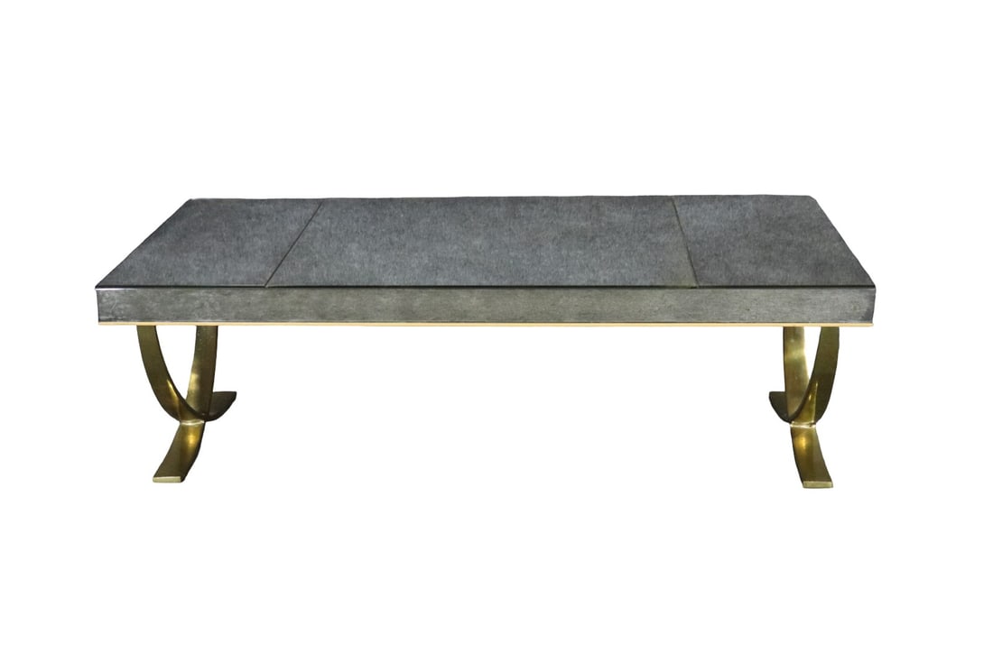 JACQUES ADNET STYLE DISTRESSED MIRRORED TOP & BRASS COFFEE TABLE: Brass frame. Distressed mirrored top. 17 3/8" h x 54" w x 25" d.