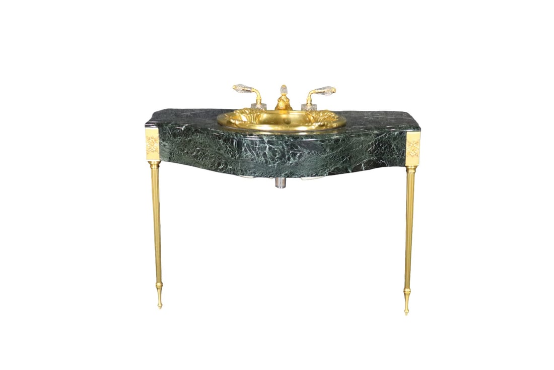 SHERLE WAGNER MARBLE SINK: Marble. Gilt legs, bowl and hardware. Crystal accents on hardware. Carved. 30 1/2" h x 41 1/4" w x 24 1/4" d.