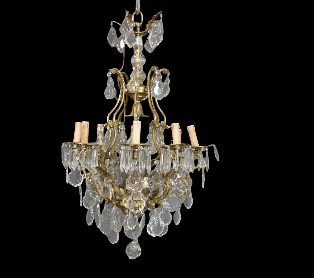 BRONZE & CRYSTAL CHANDELIER: Bronze. Crystal. 8 arms. 4 light sockets in center. 36" h x 21" diameter.