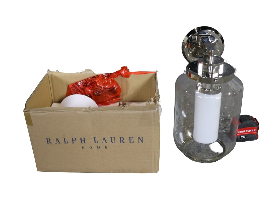 SIGNED RALPH LAUREN EVANS LIBRARY SCONCE & RALPH LAUREN POLISHED NICKEL LANTERN: Signed. Sconce is bronze finish. Lantern is polished nickel and glass shade. Boxed measures 11 1/4" h x 19" w x 21" d.