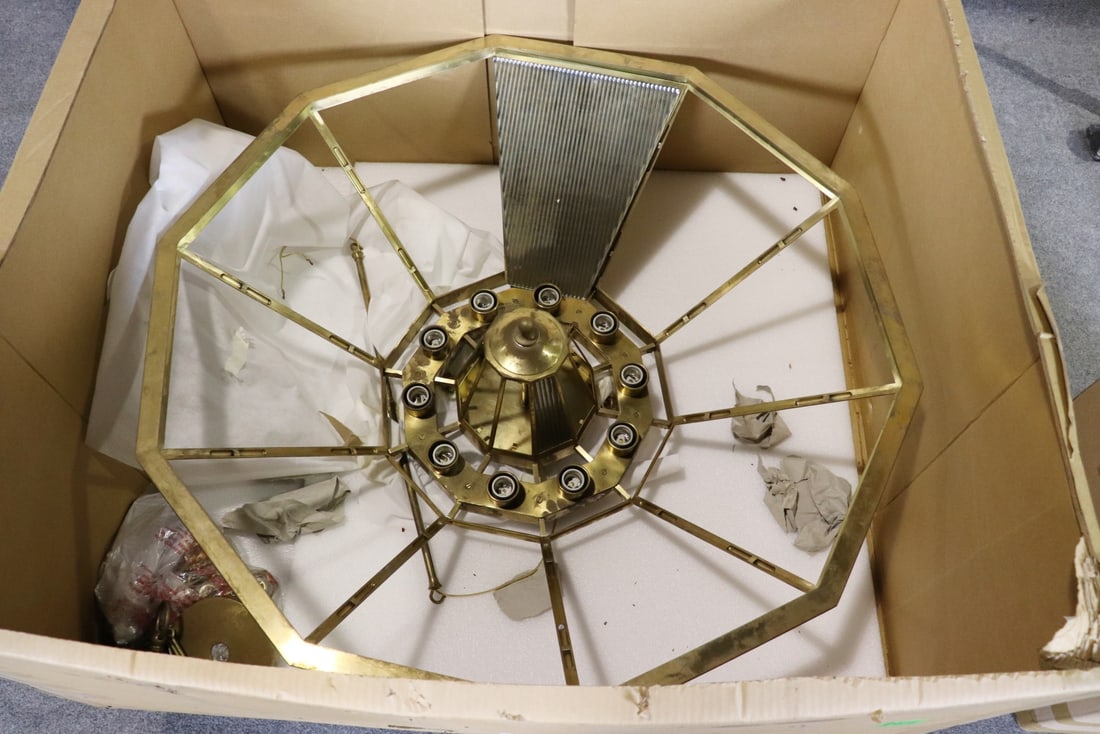 SIGNED RALPH LAUREN RIVINGTON LARGE 10 PANEL CHANDELIER: Signed. Brass. 10 panels. 10 lights. 2 boxes. One box measures 25 1/2" h x 48 3/4" w x 44" d. Other box measures 27 3/4" h x 18 5/8" w x 19 1/4" d.