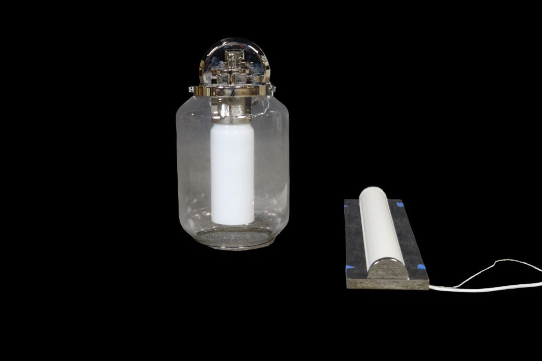 RALPH LAUREN UPTON SCONCE & RALPH LAUREN SCONCE: Unsigned. Brushed nickel. Glass shade. One measures 18 3/4" h x 4 1/2" w x 2" d. One measures 11" h x 7" diameter.