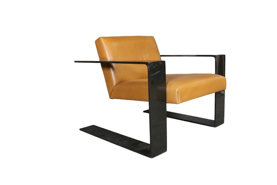 RALPH LAUREN CARBON FIBER LOUNGE CHAIR: Retails for $66,000.00 Carbon fiber frame. Leather upholstery. Cantilevered construction. Composition materials. 29" h x 34" w x 34 d. Seat height 16".