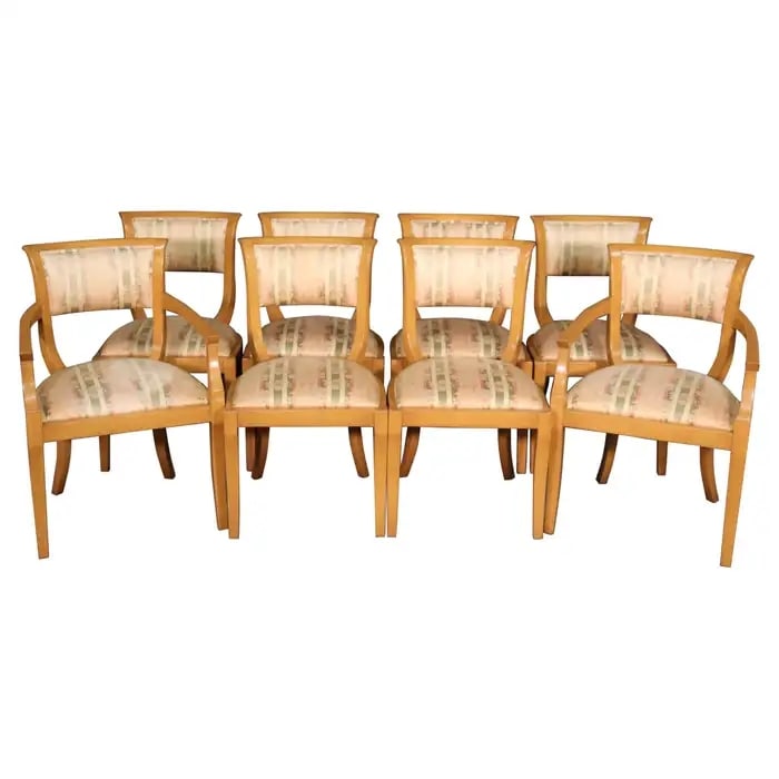 8 MID CENTURY MODERN HOLLYWOOD REGENCY STYLE DINING CHAIRS: Circa 1950's. Blonde wood finish. 6 side chairs. 2 arm chairs. Carved backs. Upholstered seats. 33" h x 23" w x 22" d. Seat height 18".