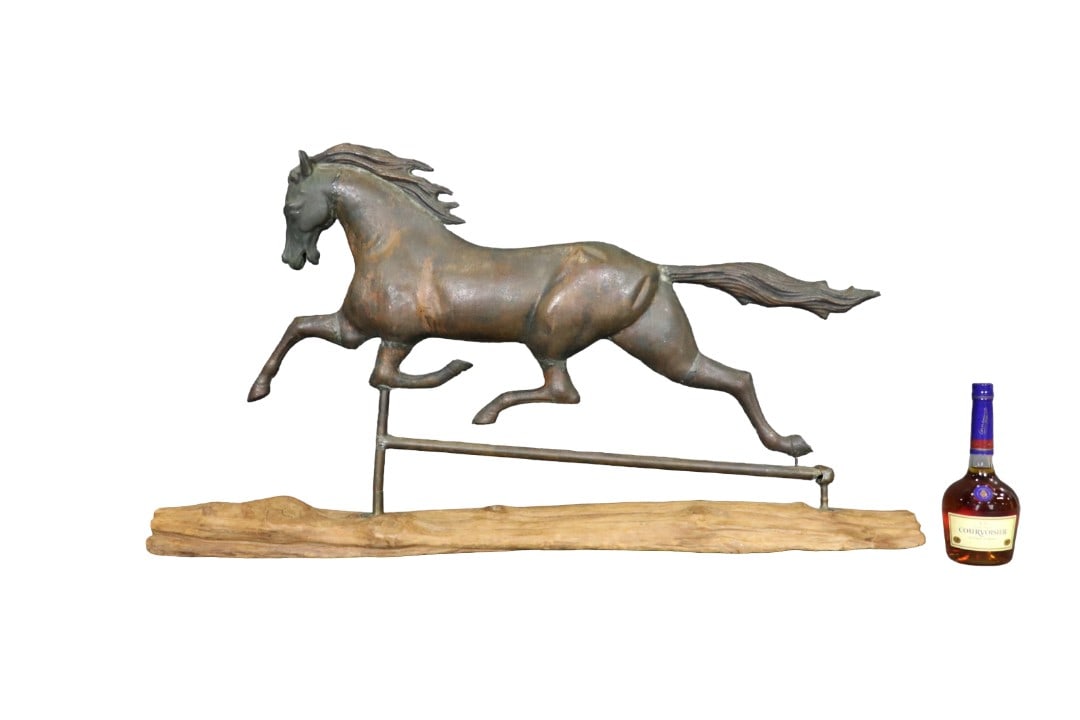 19TH C AMERICAN COPPER & ZINC RUNNING HORSE WEATHERVANE: Repurposed as a freestanding decorative sculpture. Copper. Zinc. Mounted on free form wooden base. 26 3/4" h x 48 3/4" w x 6" d.