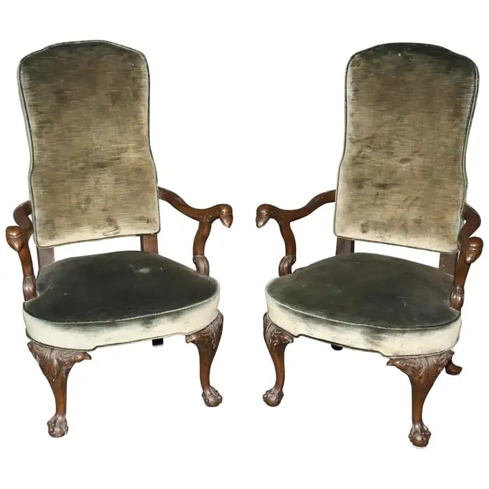 PAIR GEORGIAN EAGLE CARVED MAHOGANY ARM CHAIRS: Carved mahogany frames. Velvet upholstered back and seats. 1940's era. Eagle figural. Claw and ball feet. 41 1/2" h x 26" w x 24" d. Seat height 16".