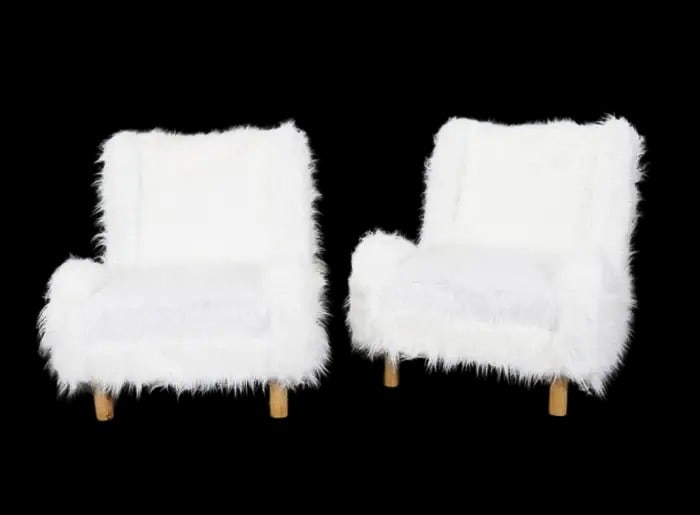 PAIR LOW SLUNG FAUX FUR CHAIRS WITH OAK FRAMES: Oak frames. Low slung backs. Faux fur. 14 1/4" h x 14 3/4" w x 23" d. Seat height 18".