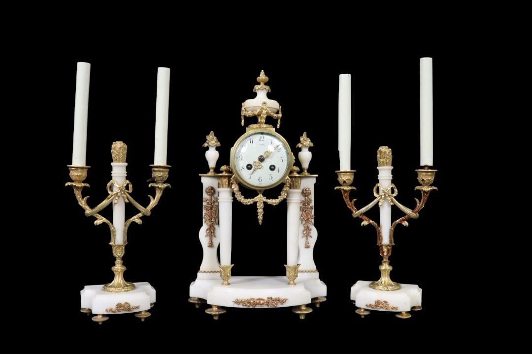 LOUIS XVI STYLE 3 PIECE CLOCK SET: Marble. 3piece. Gilt. Candelabra measures 18" h x 7" w x 3 1/2" d. Clock measures 17 1/2" h x 10" w x 5" d.