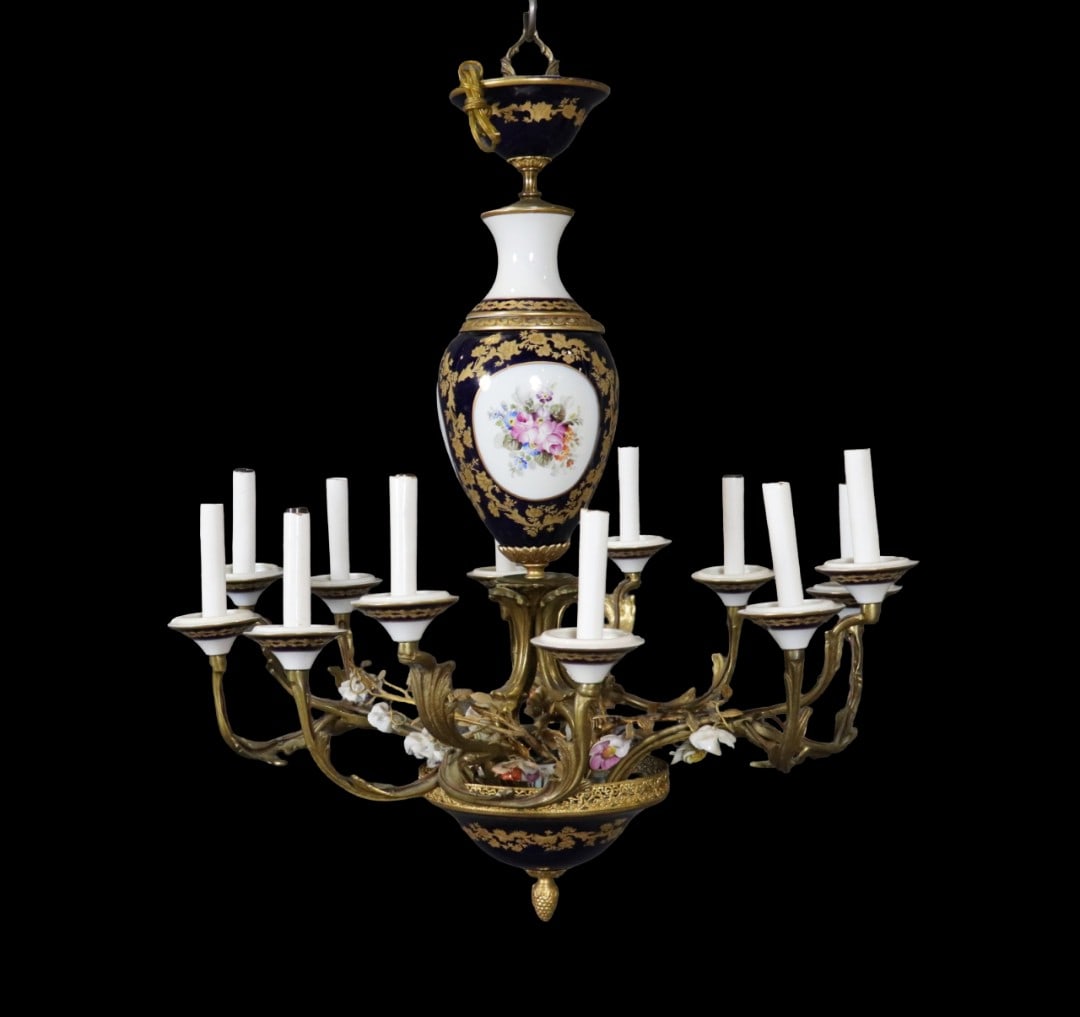12 ARM BRONZE & PORCELAIN CHANDELIER: 12 arm. Bronze. Porcelain. 28 1/2" h x 26 1/4" diameter.