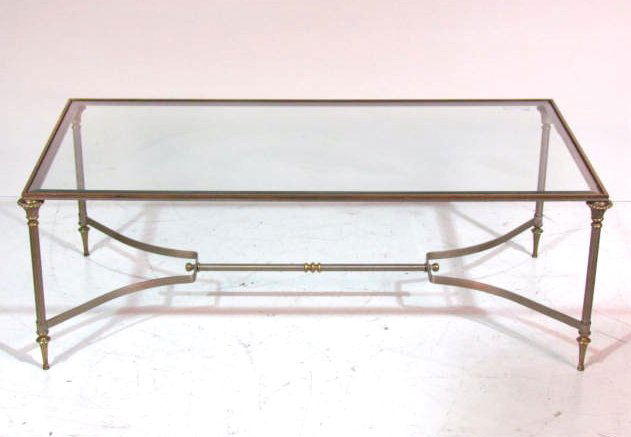 JANSEN STYLE BRASS & METAL COFFEE TABLE: Glass top. Very good condition. 17"h. x 48"w. x 24"d.