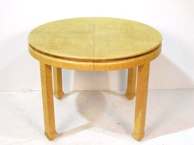 KARL SPRINGER STYLE BURLAP DINING TABLE: Good condition with some damages to burlap on legs. Considerable wear to burlap. 29"h. x 40" diameter. Two 18" boards.