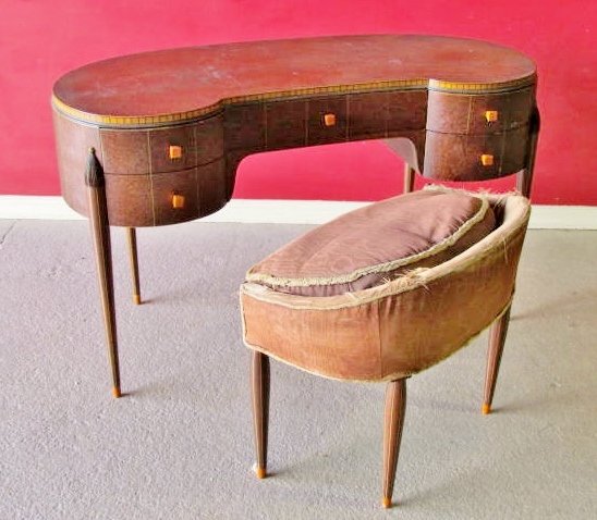 ART DECO VANITY w/ BENCH manner of RHULMANN: Burl walnut and inlay. Bakelite handles. Good condition with light wear and scratches. 30"h. x 49"w. x 18"d.