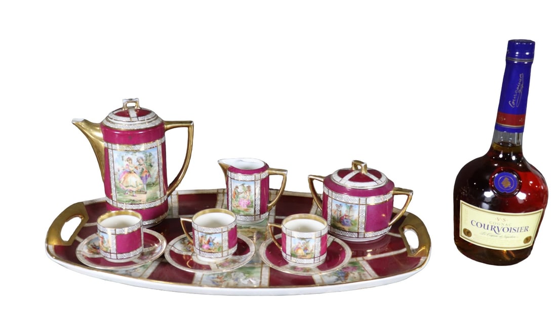 PIRKENHAMMER CZECHOSLOVAKIA 12 PIECE TEA SET: Porcelain. Painted. 12 pieces. Tray, teapot, creamer, sugar, 3 cups and 3 saucers. (Lid for teapot and sugar). 7 1/8" h x 19" w x 10 1/2" d.