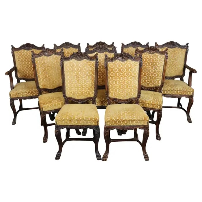 10 ANTIQUE CARVED WALNUT DINING CHAIRS: Circa 1900's. Carved walnut frames. Gold velvet upholstery. Paw feet. 47 3/4" h x 23 1/4" w x 23" d. Seat height 20 1/4".