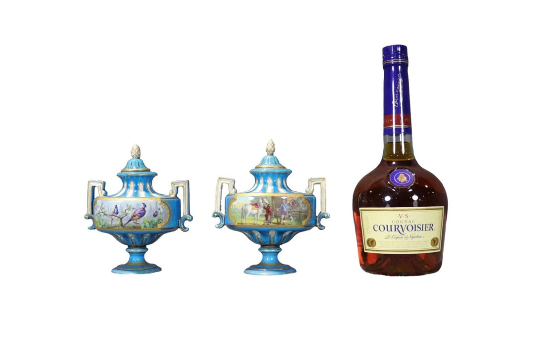 PAIR FRENCH SEVRES STYLE PORCELAIN LIDDED URNS: Makers mark on inside of lids and bottoms. Porcelain. Hand painted. 6 1/2" h x 5 3/4" w x 3 1/4" d.