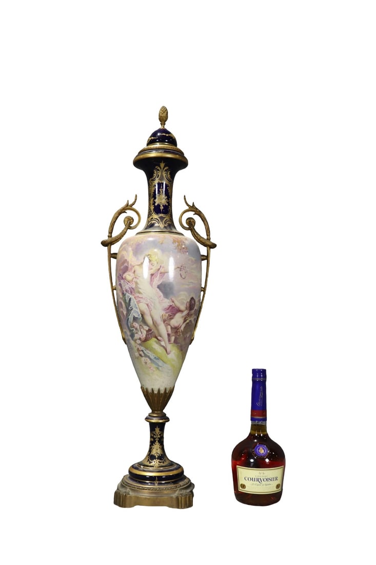 FRENCH SEVRES STYLE PORCELAIN VASE: Makers mark on lid. Porcelain. Hand painted. Gilt bronze mounts. Illegibly signed painting . 32 1/2" h x 10" w x 6" d.
