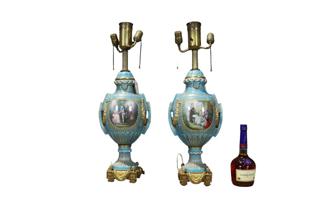 PAIR FRENCH SEVRES PORCELAIN URN LAMPS: Gilt highlights. Ornate bronze mounts. Porcelain. Enameled. 28 1/4" h x 9" w x 6" d.