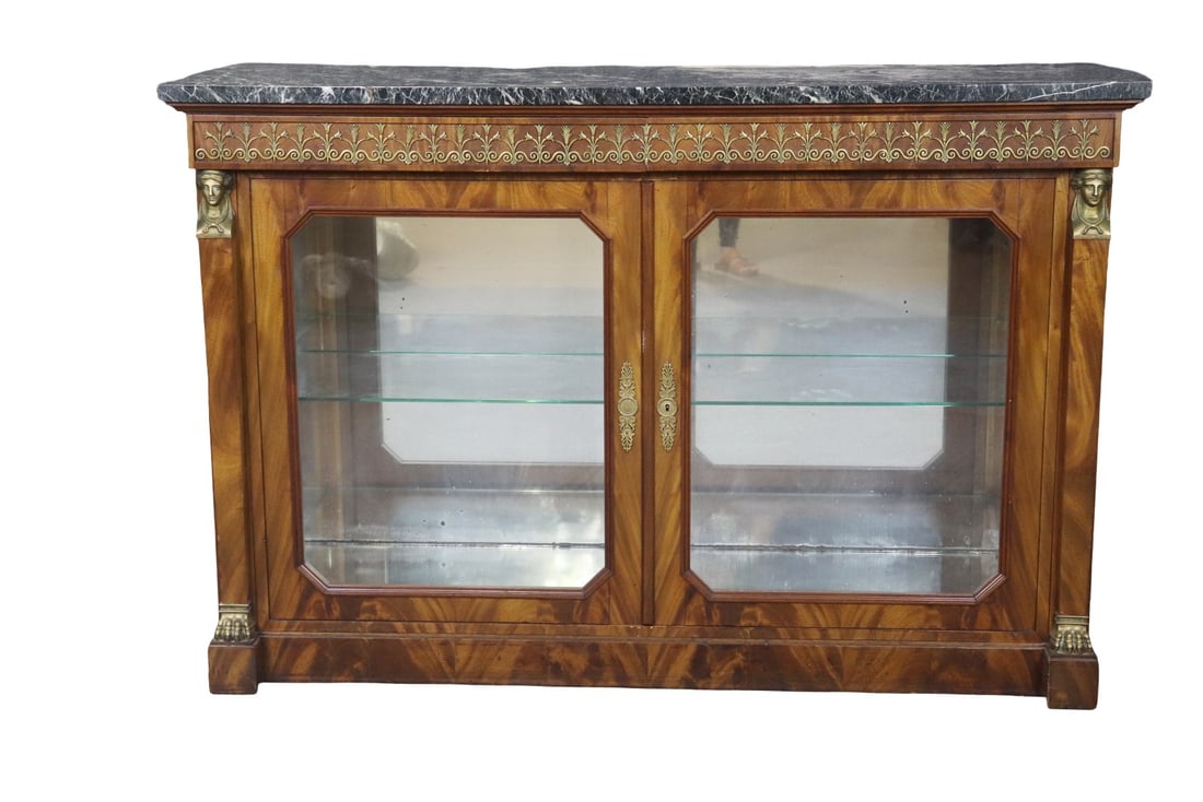 LATE 19TH C FRENCH EMPIRE STYLE BRONZE MOUNTED MARBLE TOP SERVER: Marble top. Bronze mounted. Mirrored back. 2 dovetailed drawers. Oak secondary. 2 glass doors. Mirrored bottom. Figural. 1 glass shelf. 39 1/2" h x 59" w x 19 7/8" d.