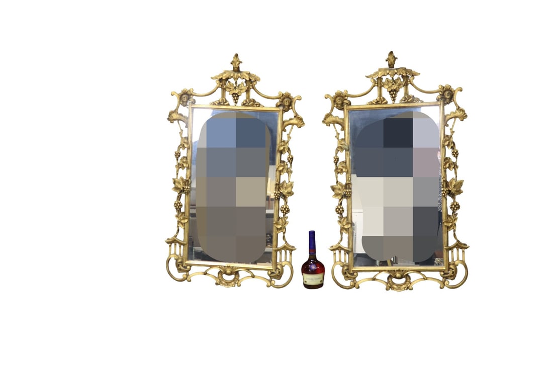 PAIR HOLLYWOOD REGENCY STYLE MIRRORS: Gilt frames. Carved. Some parts gesso over wood. 42" h x 24 3/8" w x 1" d.