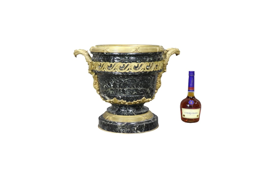 BRONZE MOUNTED MARBLE PLANTER: Bronze mounted. Marble. 16 1/4" h x 20 1/2" w x 14 1/2" d.