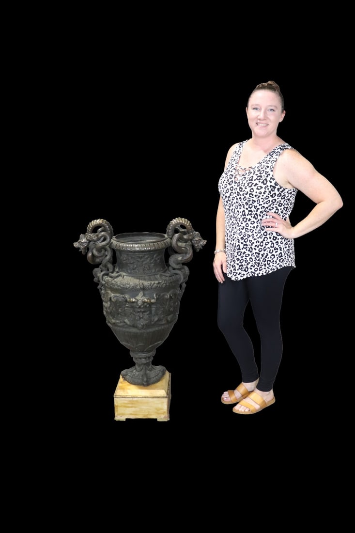 PALACE SIZE BRONZE URN ON MARBLE BASE: Bronze. Figural. Marble base. 36" h x 25 1/2" w x 18 1/2" d.