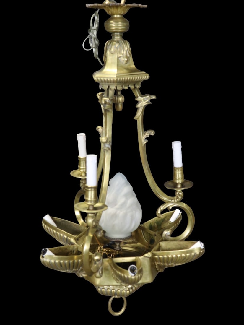 BRASS 9 LIGHT FIGURAL CHANDELIER: Brass. 9 arms. Figural. A frosted glass shade in center. 39 1/2" h x 20 1/4" diameter.